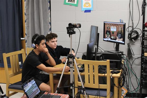 students working sound and cameras for all school show